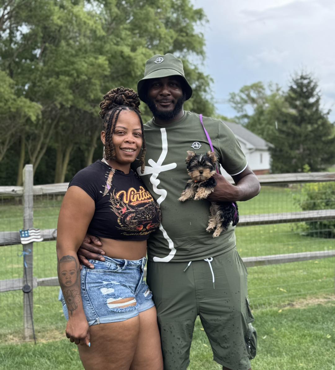 Happy family with their Yorkie puppy